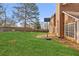 Back yard featuring green grass, fence and basketball hoop at 848 Gateshead Ct, Lawrenceville, GA 30043