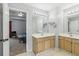 Bathroom featuring double sinks, vanity and open doorway at 848 Gateshead Ct, Lawrenceville, GA 30043