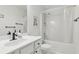 Bathroom featuring a shower, tub, vanity and white cabinets at 848 Gateshead Ct, Lawrenceville, GA 30043