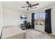 Bedroom with ceiling fan, desk, TV and window at 848 Gateshead Ct, Lawrenceville, GA 30043