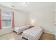 Bedroom with two twin beds, a window and neutral walls and carpet at 848 Gateshead Ct, Lawrenceville, GA 30043