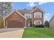 Charming two-story home with brown siding, white trim, and a well-manicured lawn at 848 Gateshead Ct, Lawrenceville, GA 30043