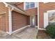 Close-up of the home's entryway, featuring a blue door and lush landscaping at 848 Gateshead Ct, Lawrenceville, GA 30043