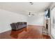 Spacious living room features hardwood floors, ceiling fan and inviting fireplace at 848 Gateshead Ct, Lawrenceville, GA 30043