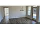 Bright dining area with hardwood floors and modern chandelier. Door to backyard at 204 Saratoga Dr, Acworth, GA 30102