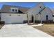 Charming single-story home featuring a welcoming porch, white siding, and an attached two-car garage at 204 Saratoga Dr, Acworth, GA 30102