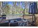 Relaxing outdoor deck area with comfortable seating and fire pit for cozy evenings at 3915 Basil Sw Way, Atlanta, GA 30331