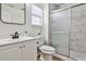 Bright bathroom with a new white vanity and a shower with decorative tile at 3915 Basil Sw Way, Atlanta, GA 30331