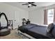 Relaxing bedroom with a comfortable bed, plush carpet, and a study area at 3915 Basil Sw Way, Atlanta, GA 30331