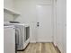 Practical laundry room with modern washer and dryer, complemented by ample storage space at 3915 Basil Sw Way, Atlanta, GA 30331