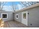 This outdoor deck space features a wooden deck with gray vinyl siding at 5153 Westbrook Pl, Union City, GA 30291