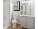 Modern bathroom with new vanity, updated fixtures, and window providing natural light at 1130 Ashbrook Dr, Lawrenceville, GA 30043