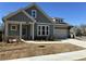 Charming craftsman-style home featuring a welcoming front porch and professionally landscaped yard at 208 Saratoga Dr, Acworth, GA 30102