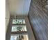 Bright living space features hardwood floors, large windows with lots of natural light, and a modern chandelier at 208 Saratoga Dr, Acworth, GA 30102