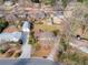 An aerial view of a house with a vast backyard, featuring nearby streets and houses at 2441 Hidden Hills Dr, Marietta, GA 30066