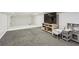 Finished basement area with carpeted floors and playroom area at 2441 Hidden Hills Dr, Marietta, GA 30066
