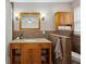 Bathroom featuring wood vanity, granite countertops, and decorative tiles at 2441 Hidden Hills Dr, Marietta, GA 30066