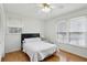 Bedroom featuring hardwood floors, light walls and dual windows at 2441 Hidden Hills Dr, Marietta, GA 30066