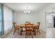Dining room featuring tile floors, a chandelier, and plenty of natural light at 2441 Hidden Hills Dr, Marietta, GA 30066