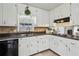 Updated kitchen featuring white cabinets, stainless steel appliances, and tile backsplash at 2441 Hidden Hills Dr, Marietta, GA 30066