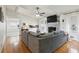 Bright living room with white brick fireplace and views into kitchen at 2441 Hidden Hills Dr, Marietta, GA 30066