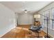 Well-lit living room with hardwood floors, a modern rocking chair, and a contemporary floor lamp at 2441 Hidden Hills Dr, Marietta, GA 30066