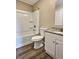 Neutral bathroom with granite countertop, white cabinets, tub, and shower at 5550 Mccrossin Cir, Stonecrest, GA 30038