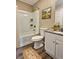 Bathroom featuring a tub, shower, white cabinets, and granite countertops at 5550 Mccrossin Cir, Stonecrest, GA 30038