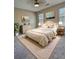 Comfortable bedroom featuring natural light, soft carpet, and calming beige walls at 5550 Mccrossin Cir, Stonecrest, GA 30038