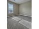 Bright bedroom with carpet, large window, and lots of space at 5550 Mccrossin Cir, Stonecrest, GA 30038