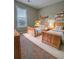 Comfortable bedroom featuring natural light, two twin beds and toys at 5550 Mccrossin Cir, Stonecrest, GA 30038