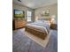Comfortable bedroom with wood furniture, carpet, and good natural light at 5550 Mccrossin Cir, Stonecrest, GA 30038