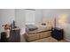 Cozy bedroom with natural light, a comfortable bed, and practical furnishings, ideal for rest and relaxation at 1280 W Peachtree Nw St # 2613, Atlanta, GA 30309