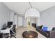 Open-concept living room with comfortable seating, modern lighting, and a versatile layout for various activities at 1280 W Peachtree Nw St # 2613, Atlanta, GA 30309