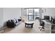 Bright living room featuring a large window with city views, modern furnishings, and a cozy atmosphere at 1280 W Peachtree Nw St # 2613, Atlanta, GA 30309