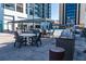 Outdoor pool area with covered seating, dining tables, and a grilling station at 1280 W Peachtree Nw St # 2613, Atlanta, GA 30309