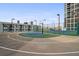 Outdoor tennis court with green and blue playing surfaces surrounded by fences and lighting at 1280 W Peachtree Nw St # 2613, Atlanta, GA 30309