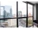 Stunning city view through large windows, showcasing the urban landscape and adding natural light to the interior at 1280 W Peachtree Nw St # 2613, Atlanta, GA 30309