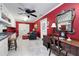 Bright bonus room with a built-in desk area, sitting area, and ceiling fan at 1341 Longwood Sw Dr, Marietta, GA 30008