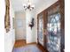 Foyer featuring decorative glass front doors, hardwood floors and a beautiful rug at 1341 Longwood Sw Dr, Marietta, GA 30008