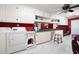 Spacious laundry room with white cabinets, a sink, and a washer and dryer at 1341 Longwood Sw Dr, Marietta, GA 30008