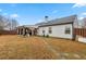 A spacious backyard, partially fenced with a covered patio and grass at 1760 Campbell Ives Dr, Lawrenceville, GA 30045
