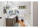 Bright bathroom with double sinks, a large mirror, and modern fixtures at 1760 Campbell Ives Dr, Lawrenceville, GA 30045