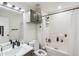 Bathroom features a vanity with a mirror and shower over tub with tile surround at 1760 Campbell Ives Dr, Lawrenceville, GA 30045