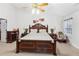 Large main bedroom with matching nightstands and dressers and a ceiling fan at 1760 Campbell Ives Dr, Lawrenceville, GA 30045