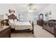 Spacious main bedroom with a large bed, dresser, and a baby crib at 1760 Campbell Ives Dr, Lawrenceville, GA 30045