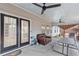 Covered patio with a seating area, ceiling fans, and access to the backyard at 1760 Campbell Ives Dr, Lawrenceville, GA 30045