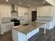 Beautiful kitchen with white cabinets, granite countertops, stainless steel appliances, and a large island at 214 Saratoga Dr, Acworth, GA 30102