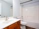Bathroom with wood-look floors, double sink vanity, and shower-tub combo at 264 Ascott Ln, Woodstock, GA 30189