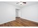 Bright bedroom featuring wood-look flooring, a ceiling fan, and neutral paint at 264 Ascott Ln, Woodstock, GA 30189